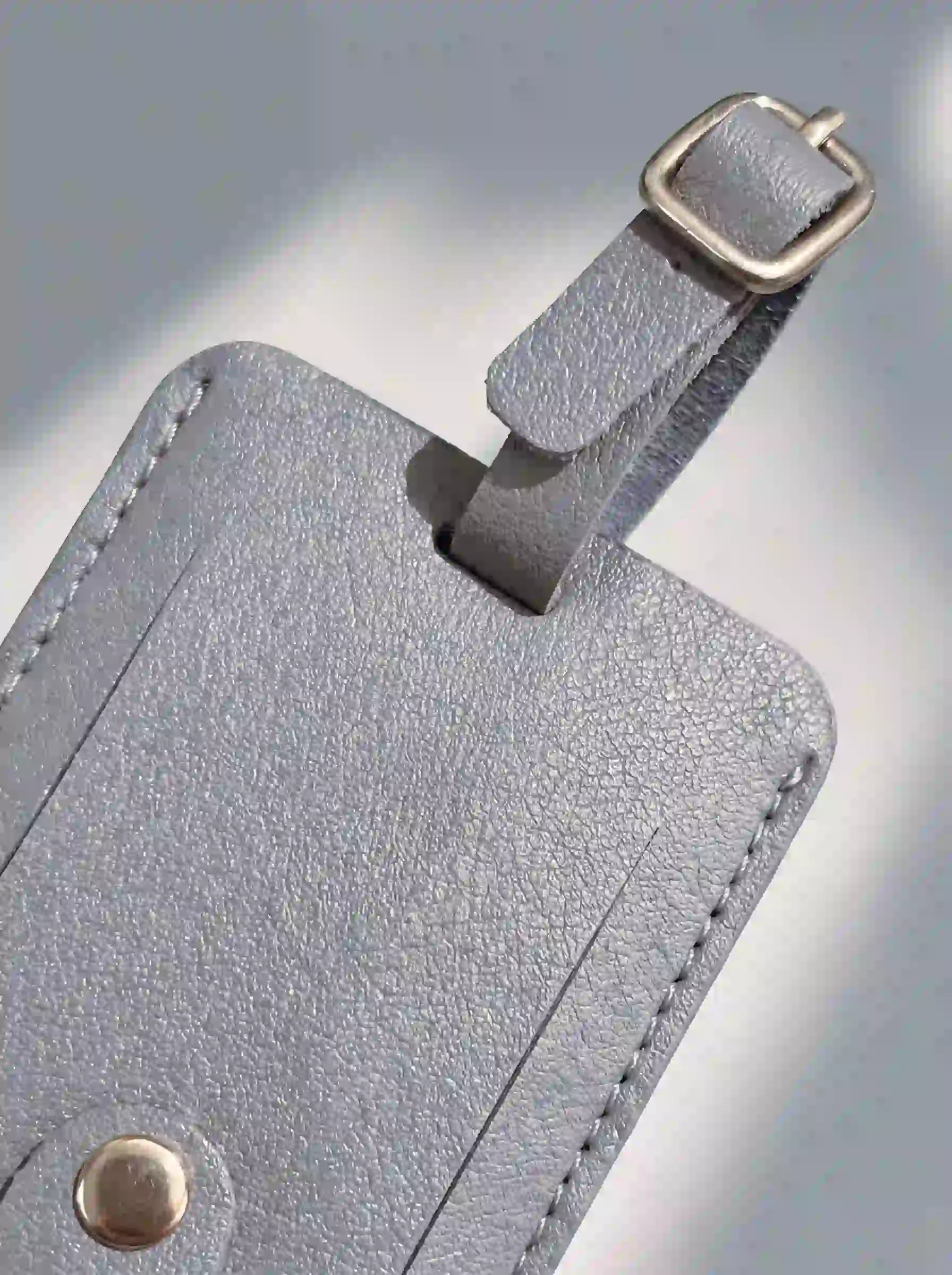 MOCAN grey leather luggage tag
